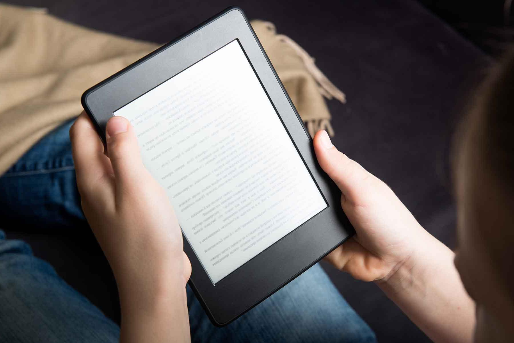 e-reader with text on a student's lap